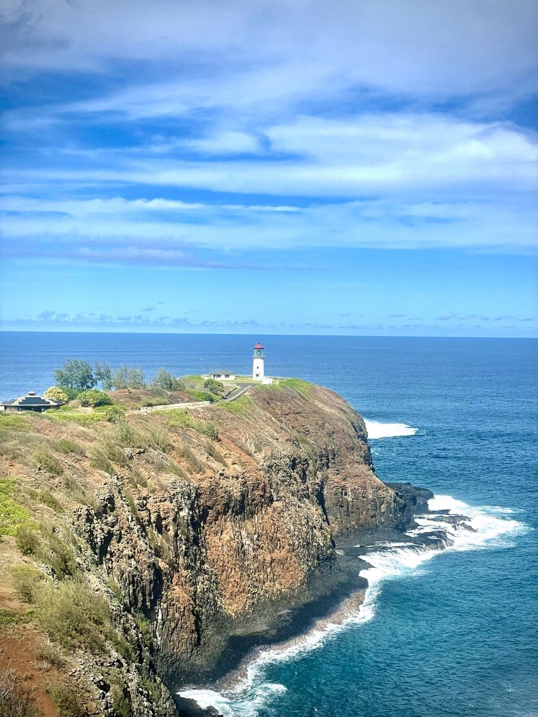 A rocky headland above blue ocean
